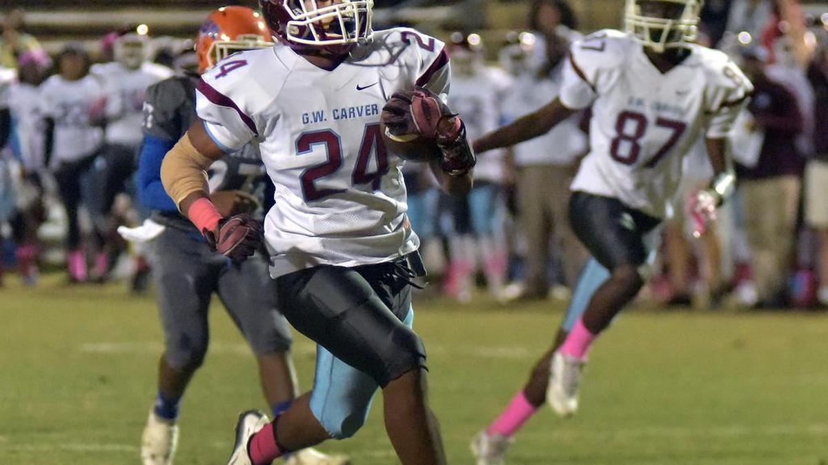 Carver’s Justin Swain on a 1st and goal at the 15 yard line races in untouched for the first touchdown of the game against Columbus High School Friday night October 21, 2016 at A.J McClung Memorial Stadium