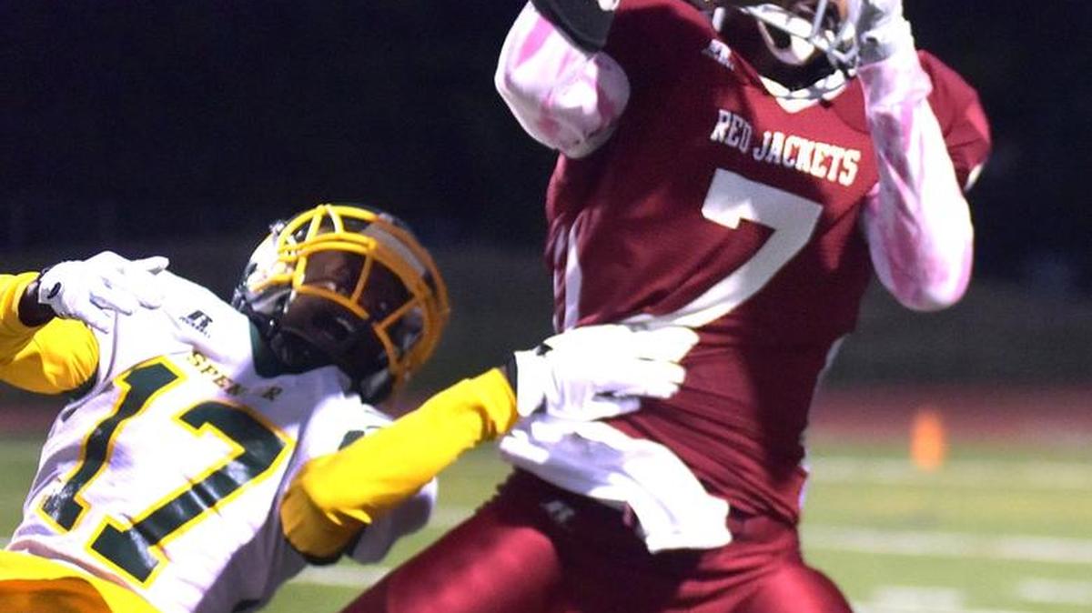 Jordan’s DeAndre Snead makes the pass reception and carries it down to the 10-yard line with Spencer’s Jaquavion Flowers defending on Jordan’s opening drive of the game Friday night at Kinnett Stadium October 7, 2016