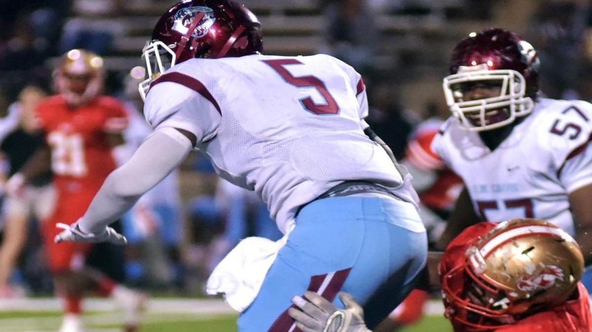 Carver’s Romello Kimbrough is tackled by Hardaway’s Jacobi Stinston during a game on Nov. 3.