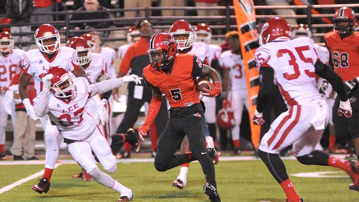 Central's Justyn Ross with a pass reception and carry for 8 yards against the Lee defenders Friday night at Garrett Harrison Stadium