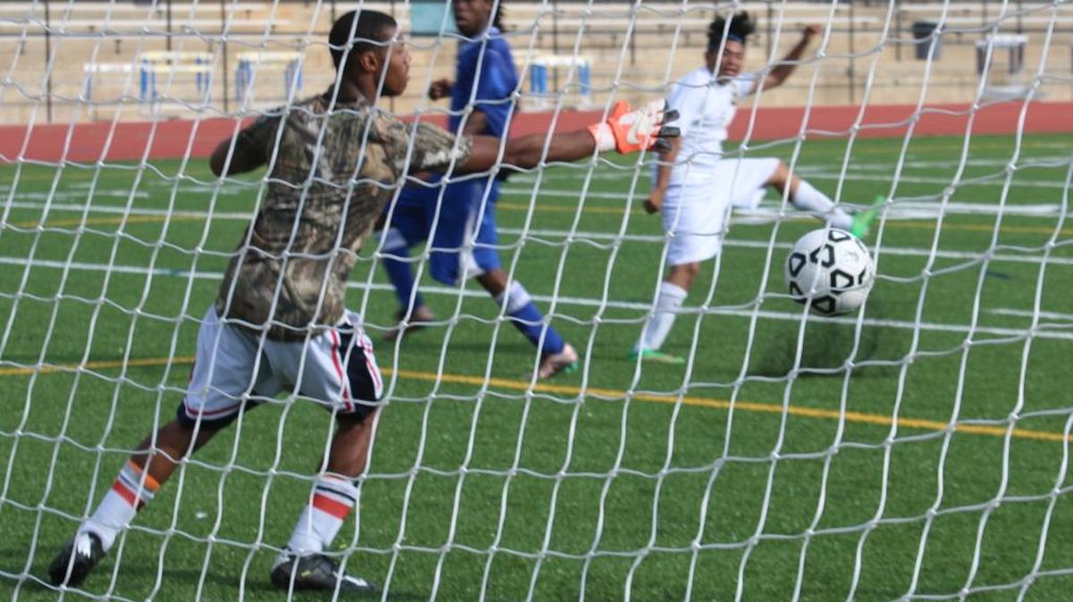 Spencer’s Jhovani Leon-Perez sends the team’s first goal into the back of the net on Thursday at Kinnett Stadium. The Greenwave won the game 3-1, their first playoff win in program history.