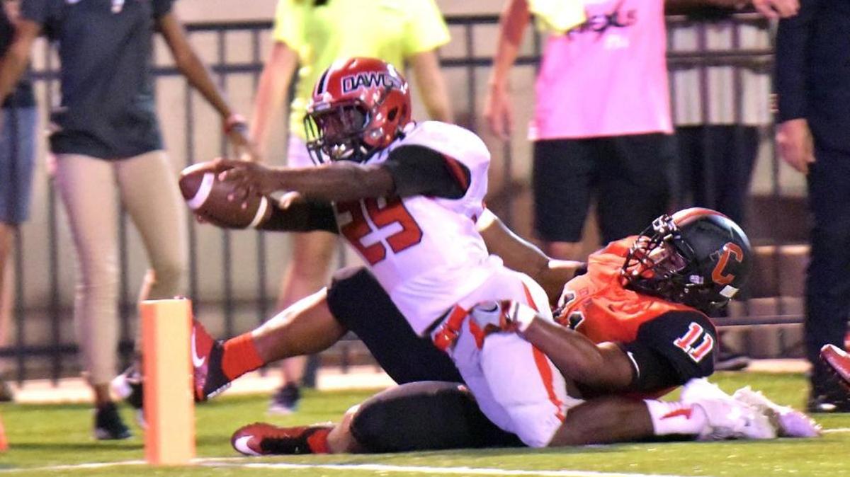 Opelika's Brantan Barnett lunges into the end zone in the final seconds of the first half against Central on Friday night.