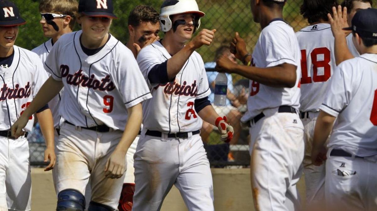 Northside High’s Gage Brown (24) is greeted by teammates after he and Cole Hill scored on a Dalton Bradford double in the second inning against Starr’s Mill on Friday.