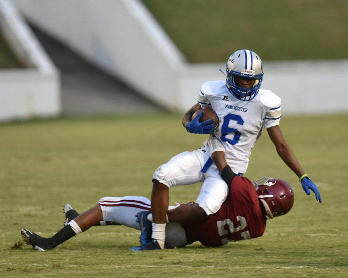 Manchester’s Ashton Bell carries the ball against Jordan on Sept. 15, 2017.