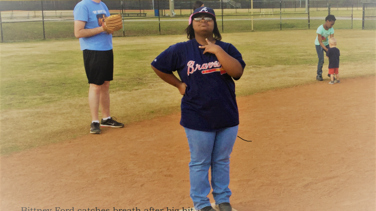 Bittney Ford catches her breath after a big hit while Brandon Watson awaits the chance to play defense.