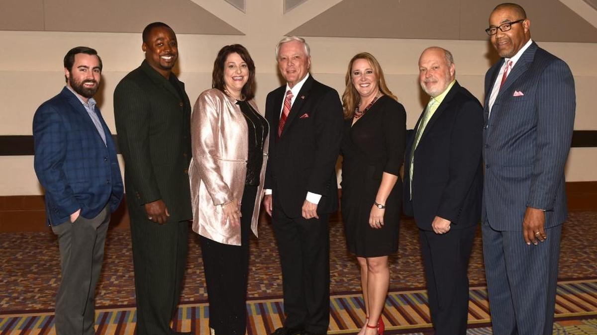 2018 Chattahoochee Valley Sports Hall of Fame inductees Trip McQuagg representing his grandfather Sam McQuagg, Maurece “Moe” Williams, Karen Hill Waters, master of ceremonies Jim White, Angela Jerman Ormsby, Scott Miller and Rudy Allen at the Hall of Fame induction banquet Saturday night, February 3, 2018