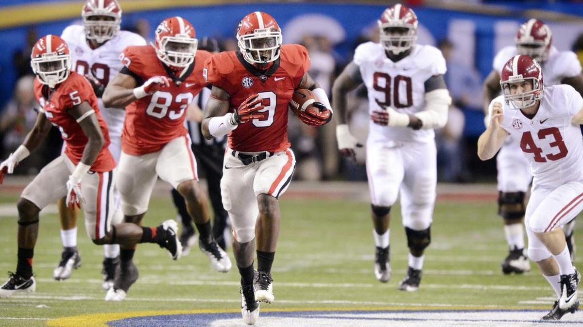 Georgia linebacker Alec Ogletree (9) returns a blocked field goal attempt for a touchdown during the SEC Championship game against Alabama in 2012.