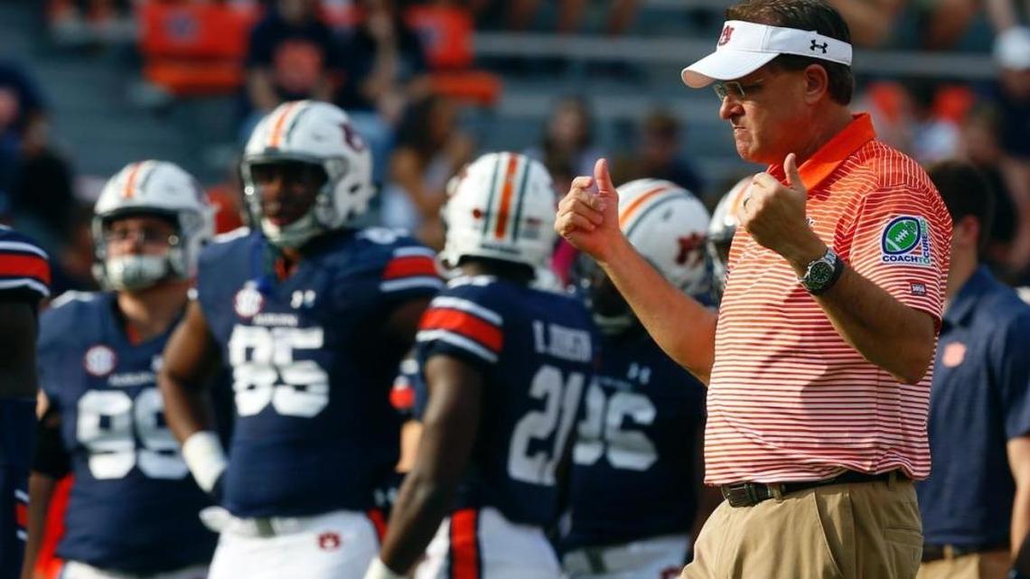 Gus Malzahn gives the thumbs up during warmups in Auburn on Saturday. His Tigers thumped Mississippi State 49-10.