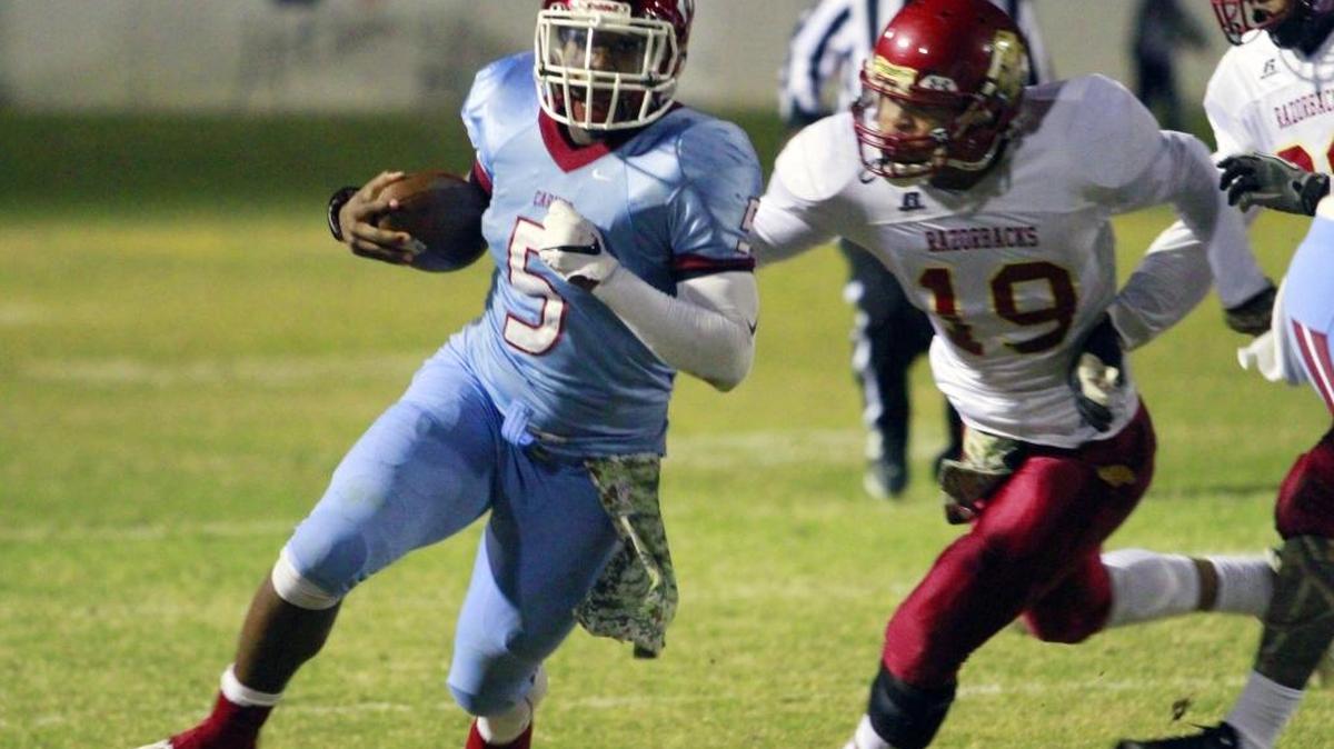 Carver quarterback Romello Kimbrough, left, runs during a Nov. 11 game against Cross Creek. Kimbrough was named Region 1-AAAA Offensive Player of the Year on Friday.