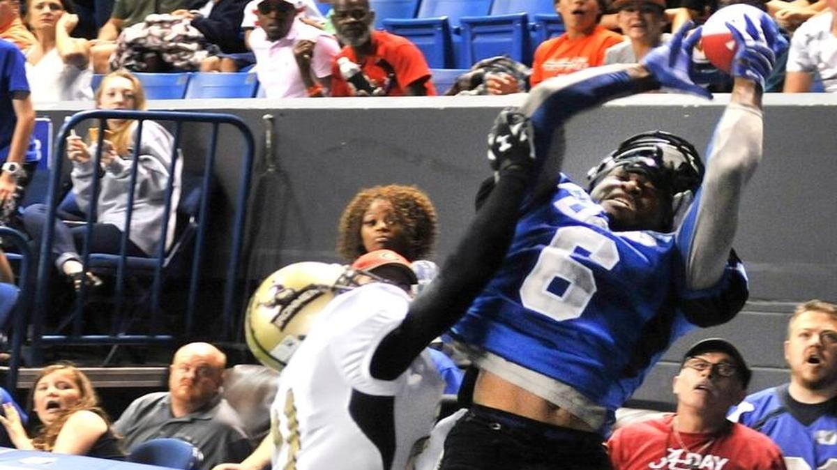 Columbus’ Jarmon Fortson makes a leaping catch in the end zone against Michigan’s Corey Edwards during the 2016 AIF championship game.
