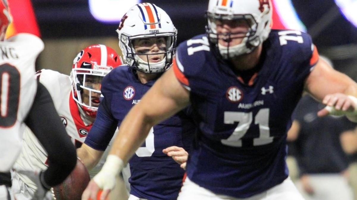 Auburn quarterback Jarrett Stidham looks for a receiver before he fumbles the ball and Georgia recovers in 2017 SEC Championship play at Mercedes Benz Stadium in Atlanta Saturday.