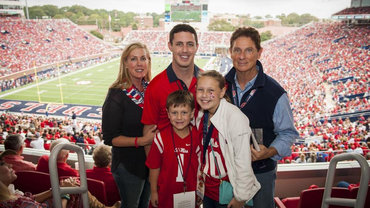 Ole Miss alum Bill Jordan, right, attends a football game at Vaught-Hemingway Stadium with, left to right, his wife Shannon and children Tyler, Colton and Graycen.