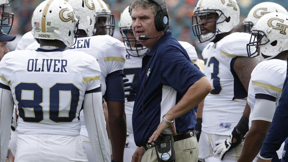 Georgia Tech coach Paul Johnson talks with his players during the first half of the Miami game last season.
