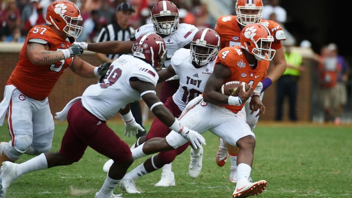 Clemson quarterback Deshaun Watson scrambles away from the Troy defenders during a game earlier this month.