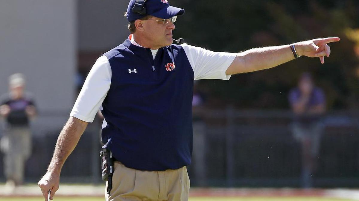 Auburn head coach Gus Malzahn calls out to the officials for a clarification in the first half of a game against Mississippi State on Saturday.