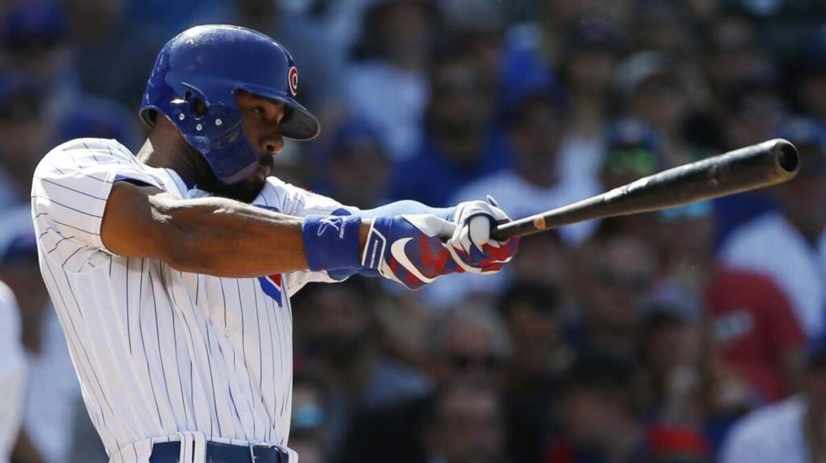 The Chicago Cubs' Jason Heyward hits a sacrifice fly during the eighth inning of a baseball game against the St. Louis Cardinals on June 2, 2017, in Chicago.