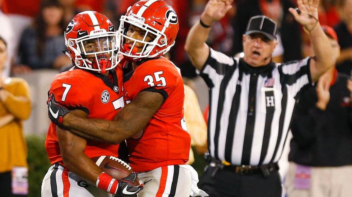 Georgia running back D'Andre Swift (7) celebrates with running back Brian Herrien (35) during the second half against Missouri during an NCAA college football game Saturday, Oct. 14, 2017, in Athens, Ga.