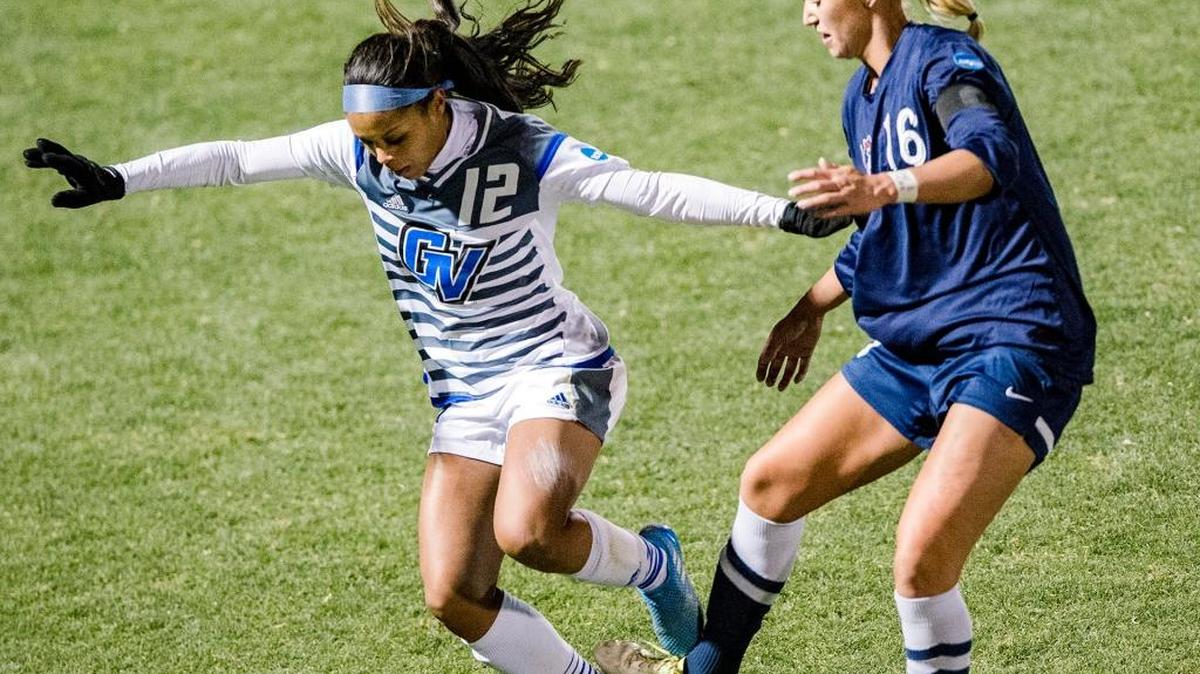 Columbus State’s Hugrun Elvarsdottir, right, battles for the ball with Grand Valley State’s Jayma Martin during the NCAA Division II women's soccer semifinal match in Kansas City. Elvarsdottir was one of four Cougars to earn All-American honors.