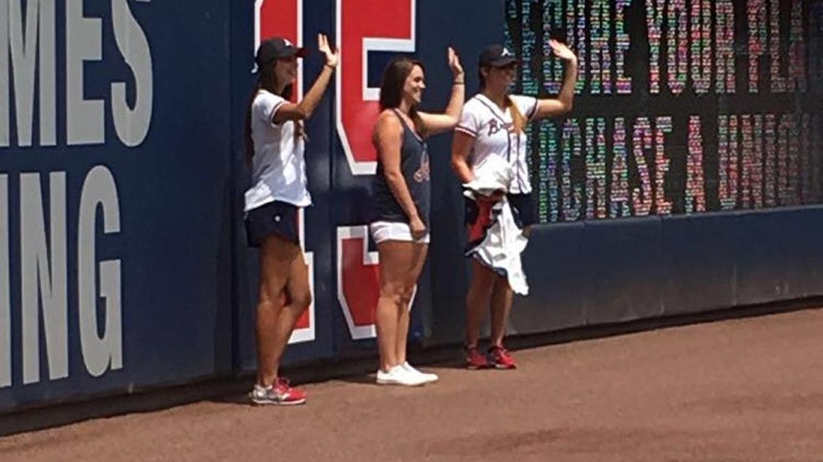 Former Columbus High softball player Emily Wynn tears down the number 16 at Turner Field on Thursday afternoon.