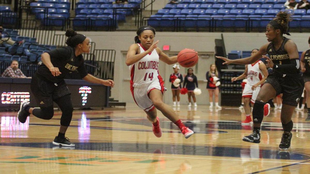 CSU’s Britteny Tatum splits two UNC-Pembroke defenders at the Frank G. Lumpkin Jr. Center on Jan. 4, 2017. Tatum and teammate Ashley Asouzu each scored their 1,000th career point on Wednesday.
