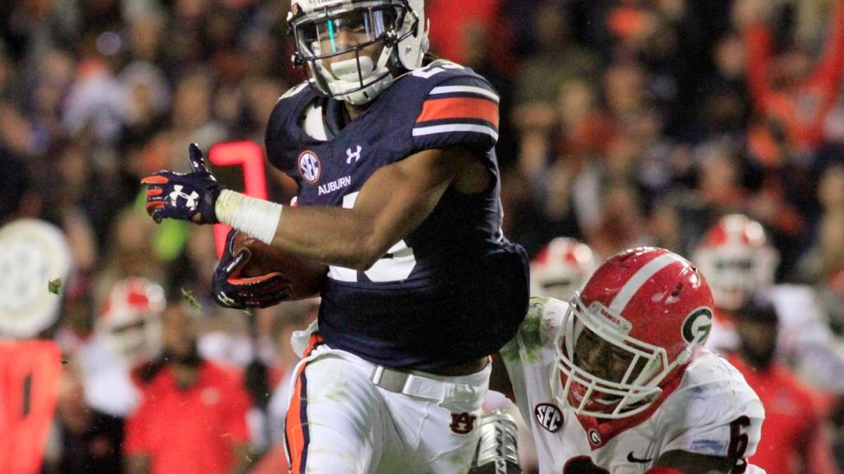 Auburn receiver Ryan Davis breaks a tackle by Georgia’s Natrez Patrice during the Tigers 40-17 win Nov. 11 at Jordan-Hare Stadium.