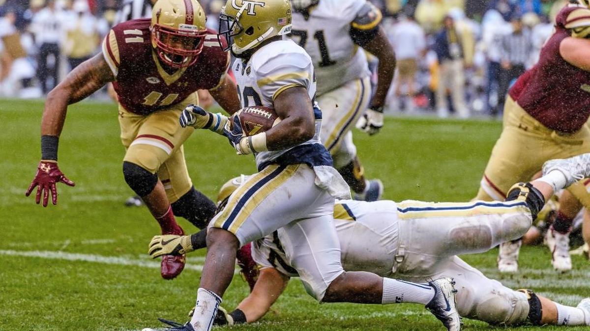 Georgia Tech’s Dedrick Mills (26) evades Boston College defensive end Wyatt Ray (11) during the first half Saturday.