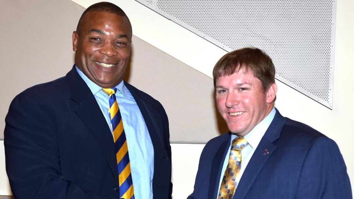 Kevin Porter, head coach of the Fort Valley State Wildcats and Gabe Giardina, head coach of the Albany State Golden Rams, shake hands at the Fountain City Classic Media/Coaches Luncheon Tuesday, October 31, 2017