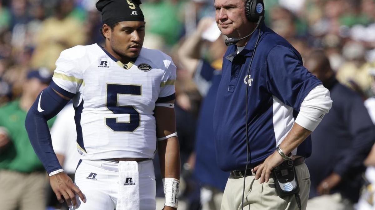 Georgia Tech head coach Paul Johnson talks with quarterback Justin Thomas during the first half against Notre Dame in South Bend, Ind., on Sept. 19, 2015.