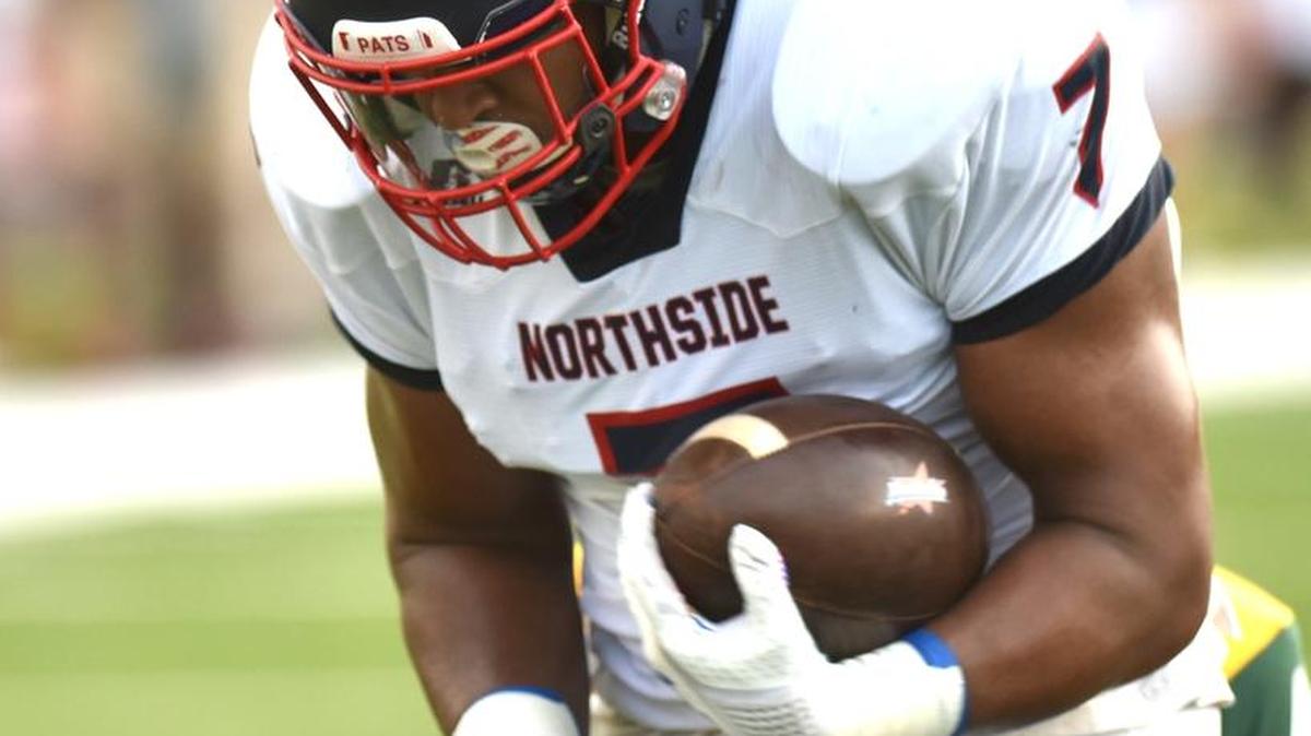 Northside's Caleb Johnson makes the catch against Spencer's Ameir Abrams and carries into the end zone in the 1st quarter of the game Thursday night at Kinnett Stadium on August 31, 2017.